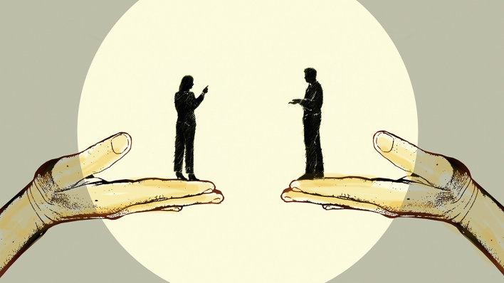 Eine Frau und ein Mann diskutieren auf stützenden Händen © imago images/Ikon Images