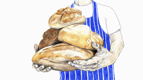Ein Bäcker mit Brotlaiben © imago/Ikon Images