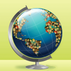Menschen bilden die Kontinente der Erde auf einem Globus © imago/Science Photo Library