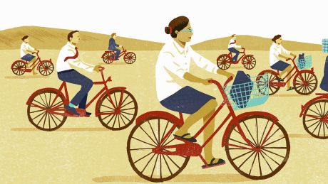 Männer und Frauen auf Fahrrädern