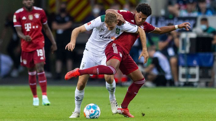 Christoph Kramer (Borussia Mönchengladbach) und Serge Gnabry (Bayern München) am 13.08.2021. ©imago images/Moritz Mueller