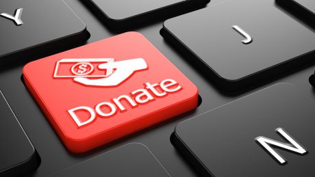Eine rote Taste auf einer Tastatur mit dem Schriftzug "Donate". (Bild: imago/Panthermedia)