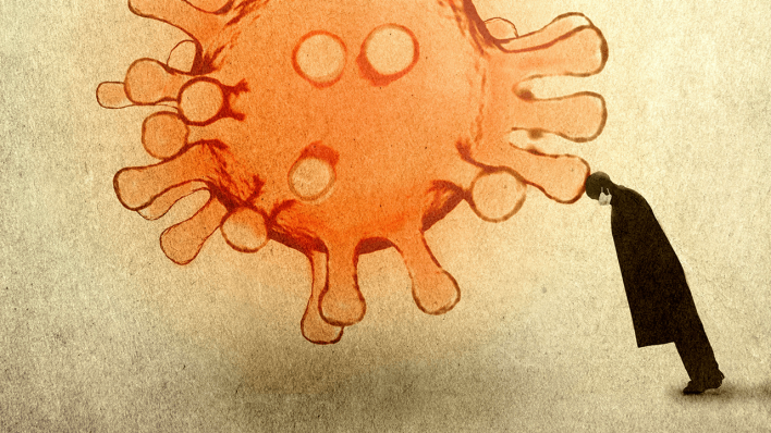 Ein Mann mit einer Gesichtsmaske lehnt an einem Coronavirus © imago images/Ikon Images
