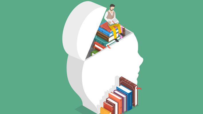 Ein Mann beim Lernen mit vielen Büchern © IMAGO / Zoonar